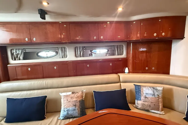 Slide: The Image of Luxurious interior of 2004 Sea Ray 550 Sundancer yacht with elegant wood cabinetry and plush seating. - 9