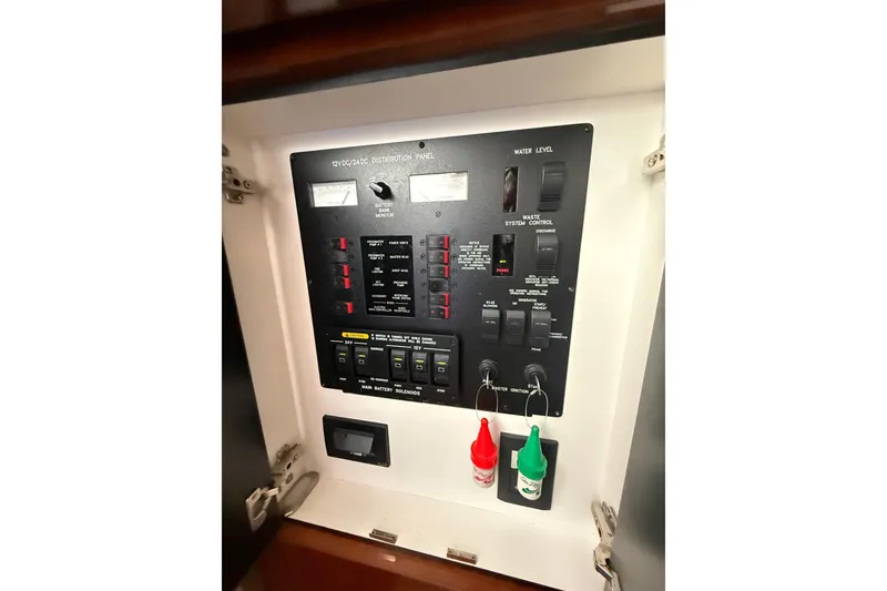Slide: The Image of Electrical distribution panel on a 2004 Sea Ray 550 Sundancer yacht. - 107