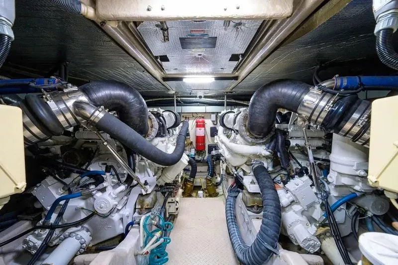 Slide: The Image of Engine room of 2004 Sea Ray 550 Sundancer yacht, showcasing dual engines and mechanical systems. - 38