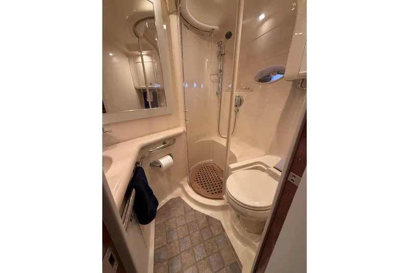 Slide: The Image of Luxurious bathroom in 2004 Sea Ray 550 Sundancer yacht with shower and toilet. - 104