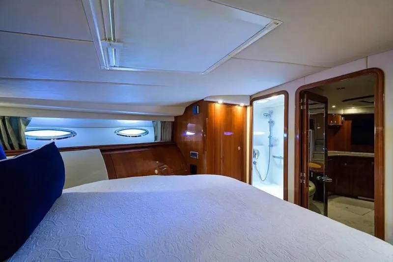 Slide: The Image of Luxurious cabin interior of 2004 Sea Ray 550 Sundancer yacht with bed and ensuite bathroom. - 27