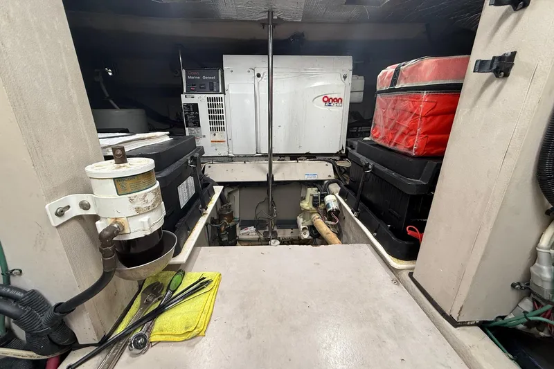 Slide: The Image of Engine room of a 2004 Sea Ray 550 Sundancer with Onan marine generator. - 57