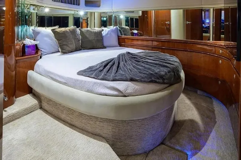 Slide: The Image of Luxurious bedroom interior of 2004 Sea Ray 550 Sundancer yacht with plush bedding. - 28