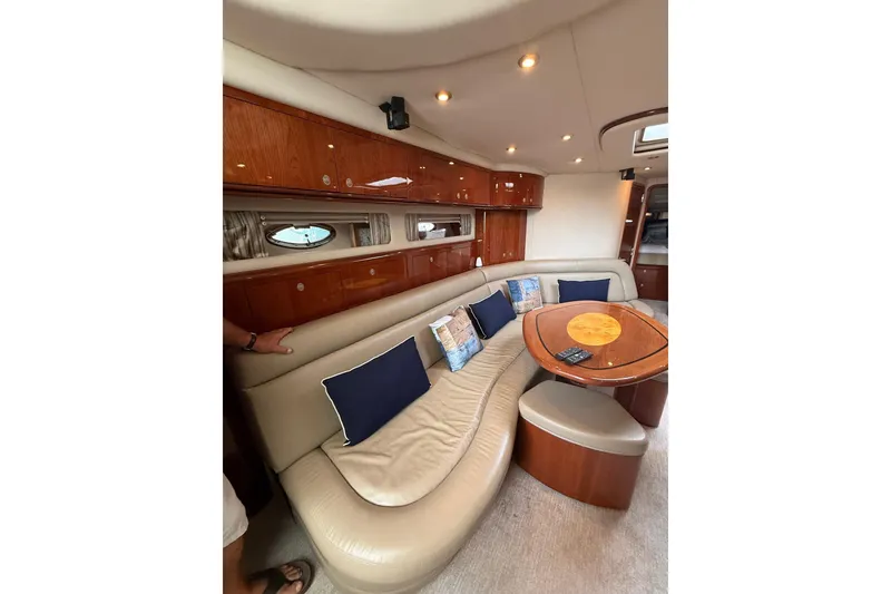 Slide: The Image of Luxurious interior of 2004 Sea Ray 550 Sundancer yacht with plush seating and elegant wood finishes. - 96