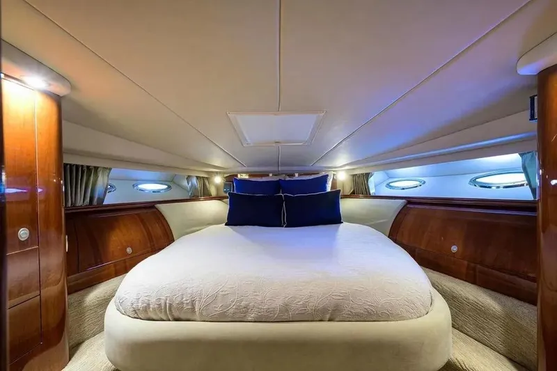 Slide: The Image of Luxurious cabin interior of 2004 Sea Ray 550 Sundancer yacht with elegant bedding. - 26