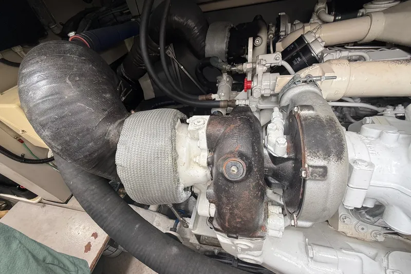 Slide: The Image of Engine compartment of a 2004 Sea Ray 550 Sundancer yacht, showcasing mechanical components. - 47