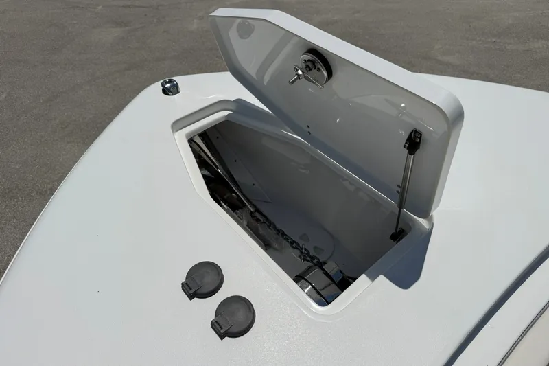 Slide: The Image of Open storage compartment on 2026 Sea Hunt Gamefish 25 boat deck. - 30