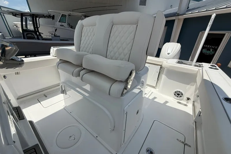 Slide: The Image of Luxurious seating on 2026 Sea Hunt Gamefish 25 boat, featuring elegant white upholstery. - 23