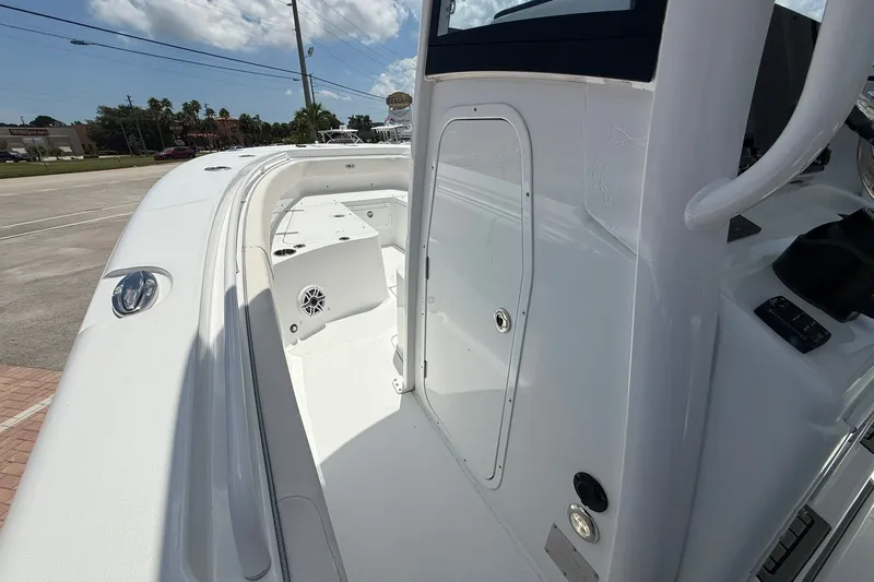 Slide: The Image of 2026 Sea Hunt Gamefish 25 boat interior, showcasing sleek white design and spacious layout. - 24