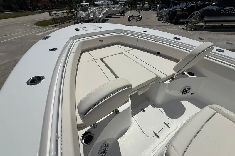 Slide: The Image of 2026 Sea Hunt Gamefish 25 boat interior with cushioned seating and storage compartments. - 29
