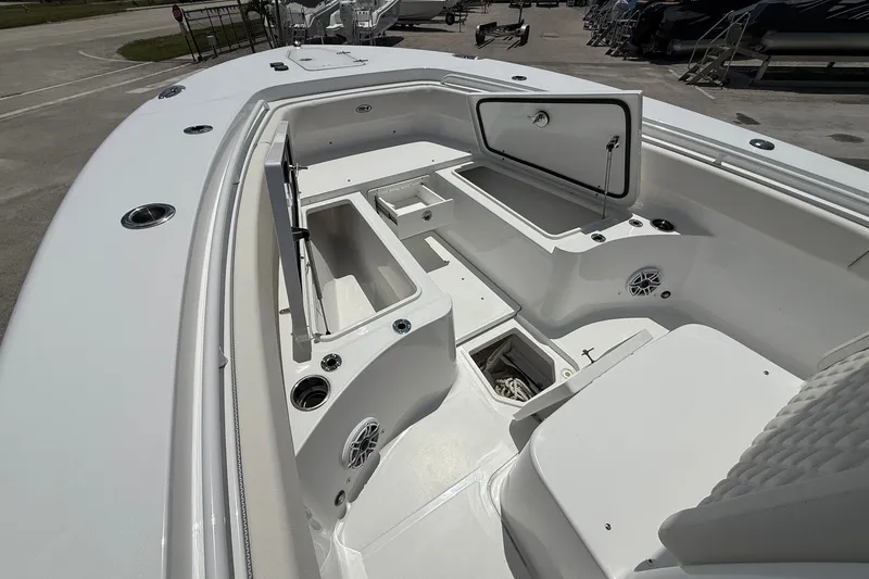 Slide: The Image of 2026 Sea Hunt Gamefish 25 boat interior with open storage compartments and seating. - 26