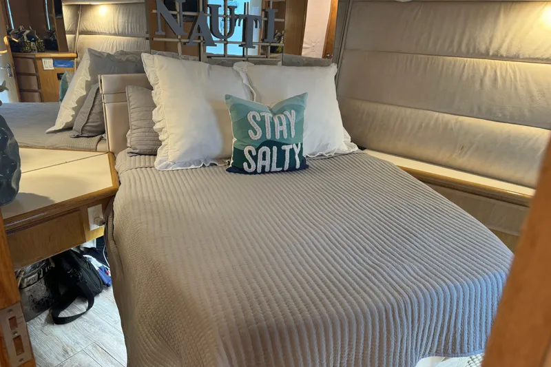 Slide: The Image of Cozy bedroom interior of 1994 Hatteras 54 Convertible yacht with nautical decor. - 26