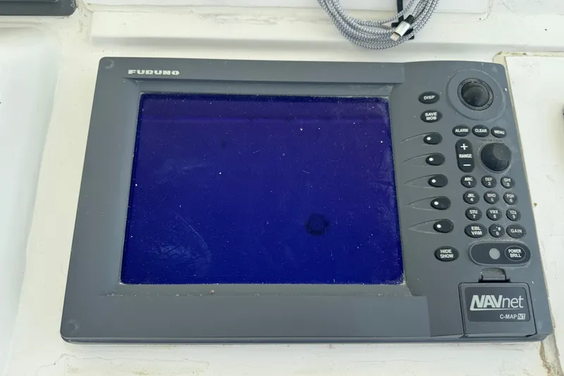 Slide: The Image of Furuno navigation system on 1994 Hatteras 54 Convertible yacht dashboard. - 15