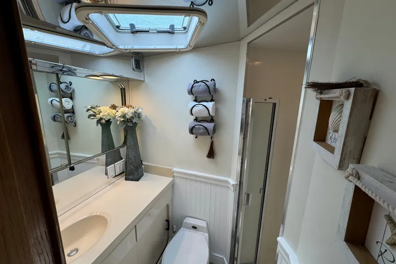 Slide: The Image of Bathroom interior of 1994 Hatteras 54 Convertible yacht, featuring modern fixtures and decor. - 24