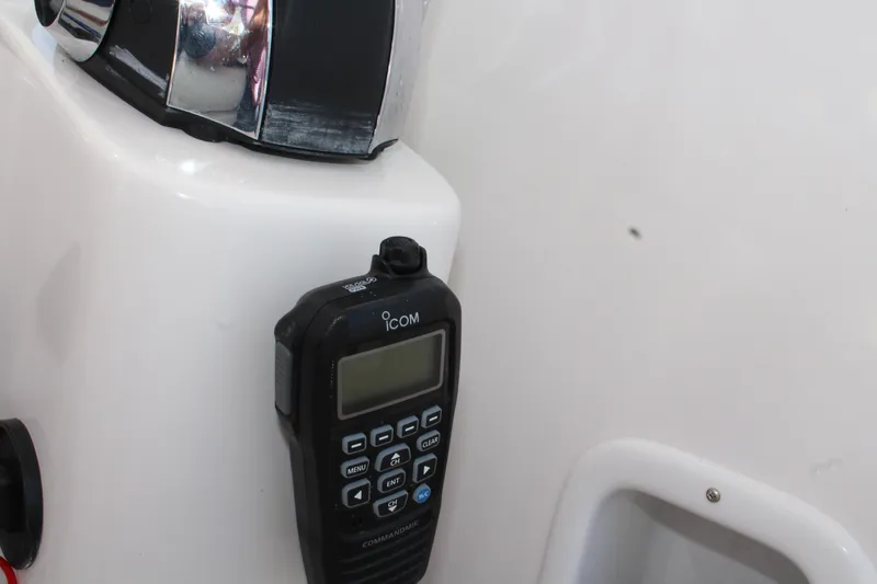 Slide: The Image of ICOM radio on 2006 Pro-Line 32 Express boat dashboard. - 33