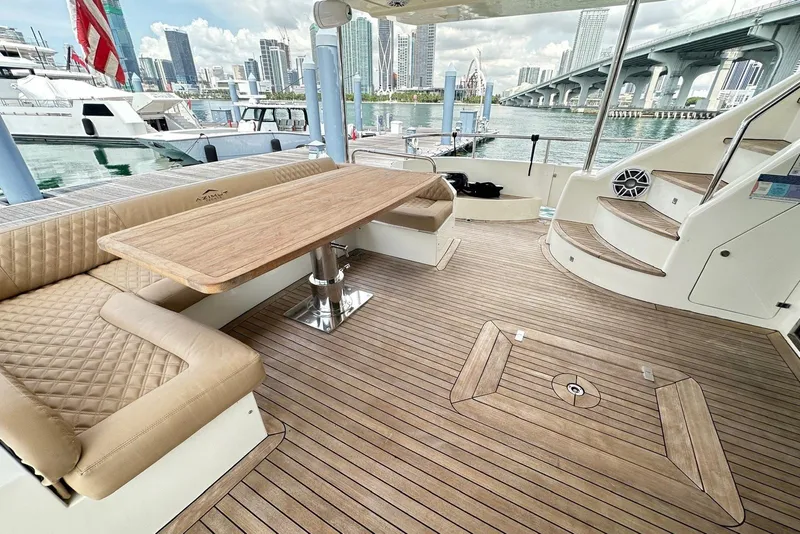 Slide: The Image of Luxurious 2010 Azimut 75 yacht deck with elegant seating and scenic waterfront view. - 3