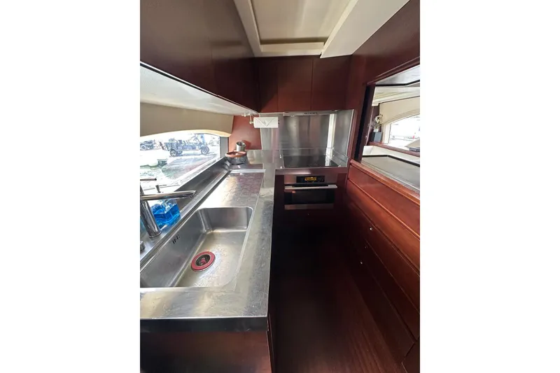 Slide: The Image of Modern kitchen interior on a 2010 Azimut 75 yacht, featuring stainless steel appliances. - 15
