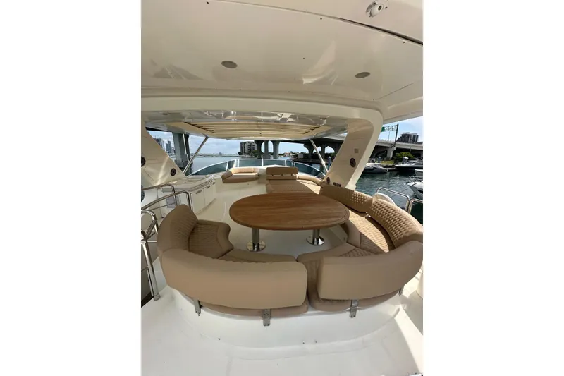 Slide: The Image of Luxurious 2010 Azimut 75 yacht with elegant outdoor seating and wooden table. - 26