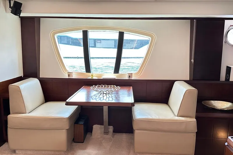 Slide: The Image of Luxurious interior of 2010 Azimut 75 yacht with elegant dining area and large window. - 7