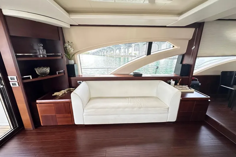 Slide: The Image of Luxurious interior of 2010 Azimut 75 yacht with elegant white sofa and wooden accents. - 14