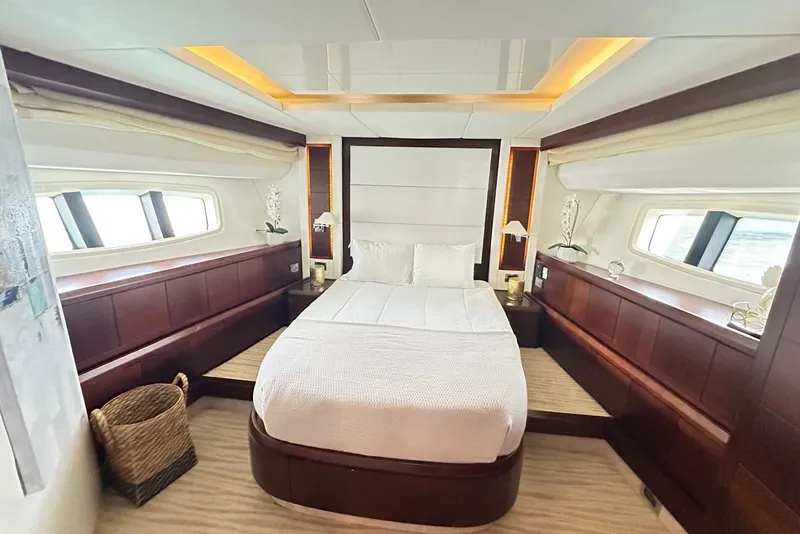 Slide: The Image of Luxurious bedroom interior of 2010 Azimut 75 yacht with elegant wood paneling and large windows. - 18