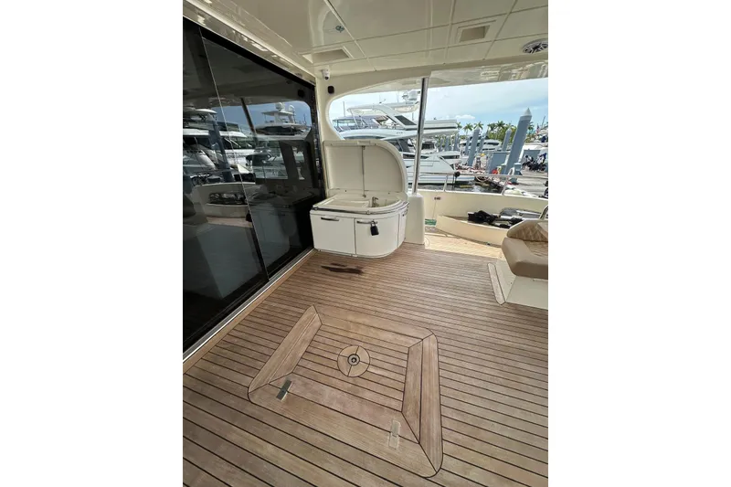 Slide: The Image of Luxurious 2010 Azimut 75 yacht deck with sleek wood flooring and modern amenities. - 25