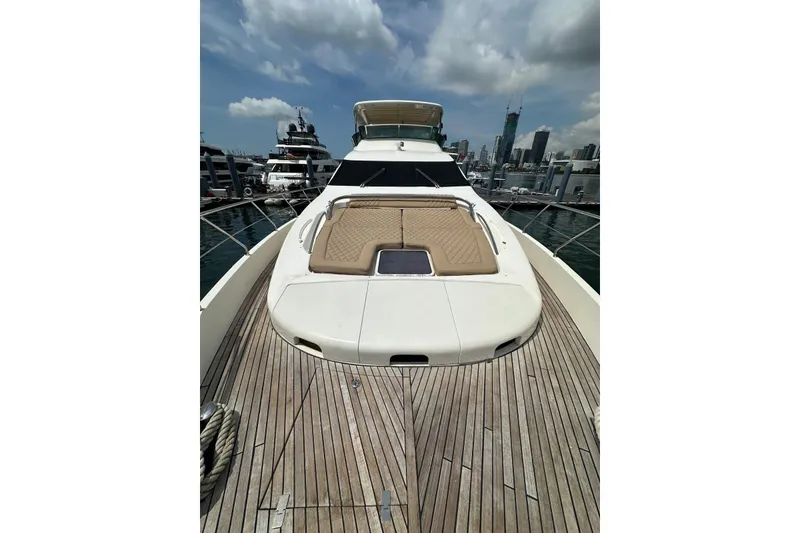 Slide: The Image of 2010 Azimut 75 yacht with spacious deck and city skyline in background. - 24