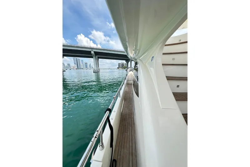 Slide: The Image of Side view of 2010 Azimut 75 yacht with city skyline and bridge in background. - 30