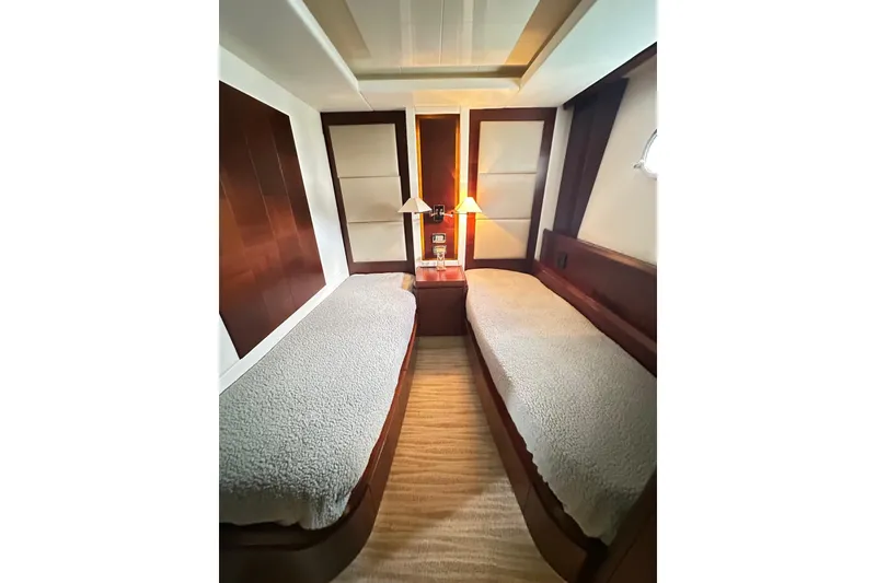 Slide: The Image of Luxurious twin cabin interior on 2010 Azimut 75 yacht, featuring elegant wood finishes. - 8