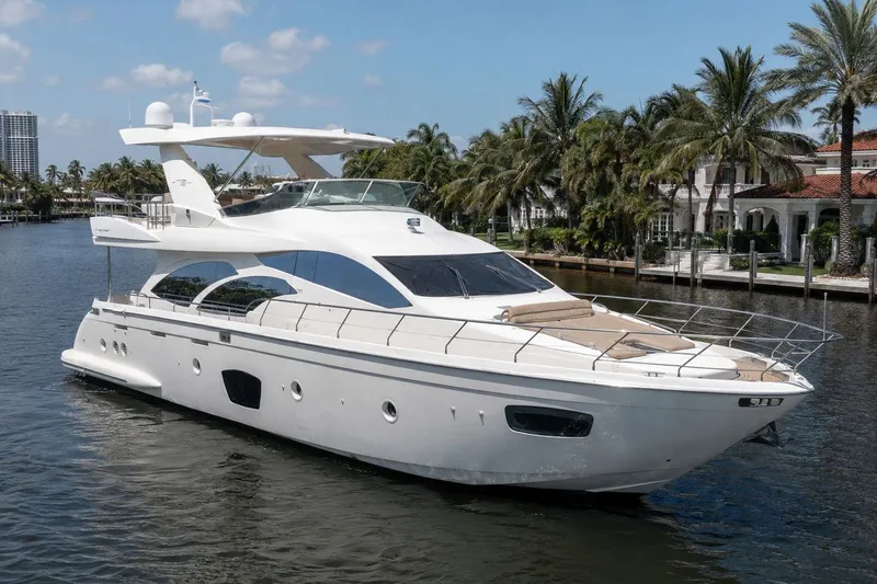 The Image of Luxury 2010 Azimut 75 yacht cruising on a scenic waterway with palm trees. - 0