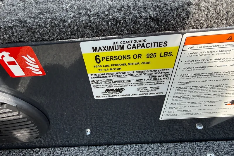 Slide: The Image of 2027 Lund 1700 Adventure Sport boat capacity label, 6 persons or 925 lbs limit. - 9