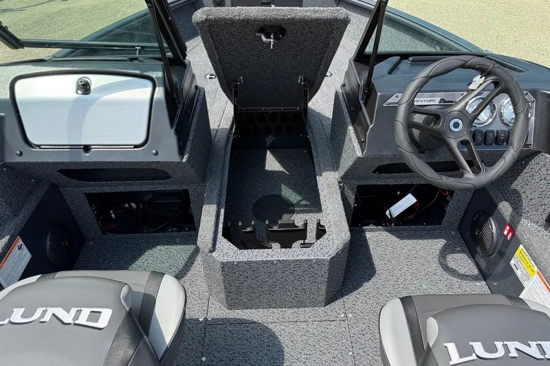 Slide: The Image of Interior of 2027 Lund 1700 Adventure Sport boat, featuring steering wheel and seating. - 5