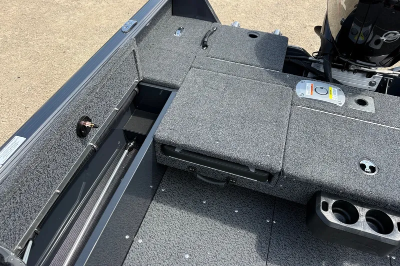 Slide: The Image of 2027 Lund 1700 Adventure Sport boat interior with storage compartments and motor. - 12
