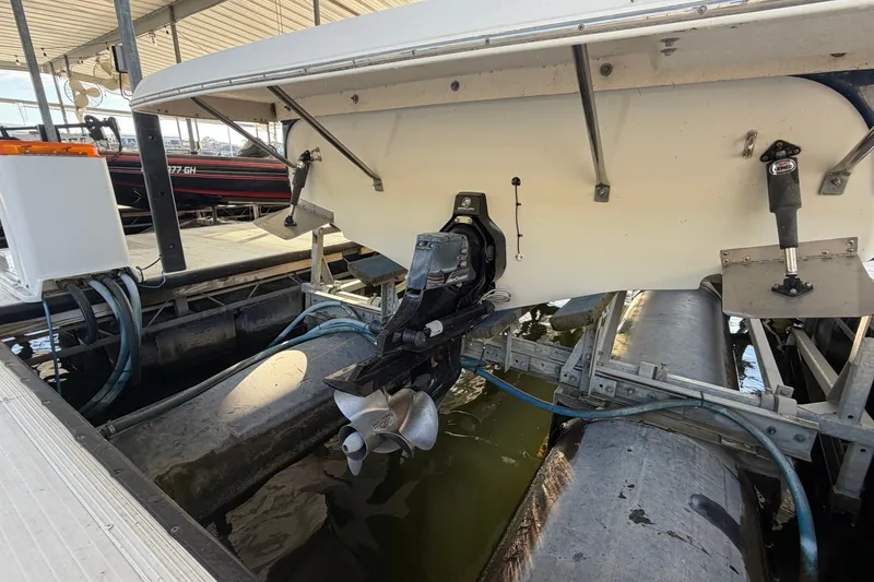 Slide: The Image of 2006 Crownline 290 CR boat stern with propeller in marina dock. - 4