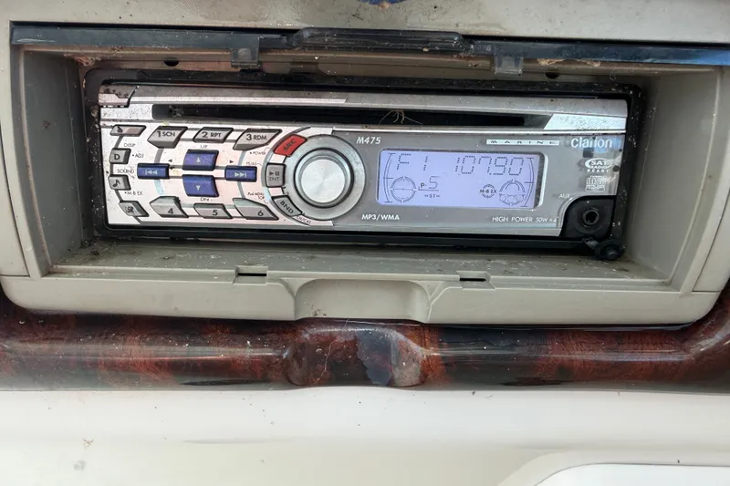 Slide: The Image of Clarion marine stereo in a 2006 Crownline 290 CR boat dashboard. - 29