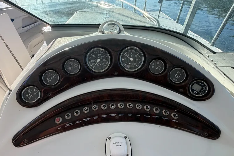 Slide: The Image of Dashboard of a 2006 Crownline 290 CR boat with gauges and controls. - 28