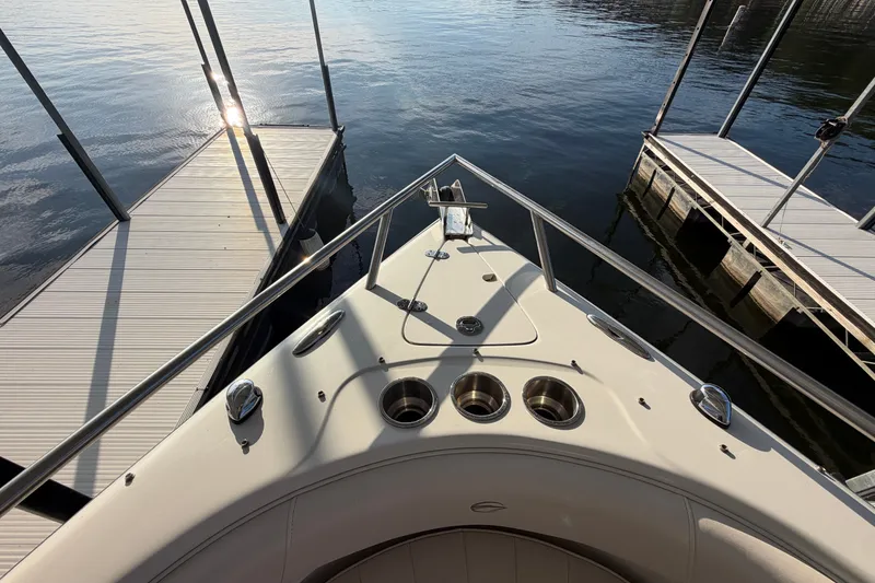 Slide: The Image of Bow view of 2006 Crownline 290 CR boat docked at marina. - 23