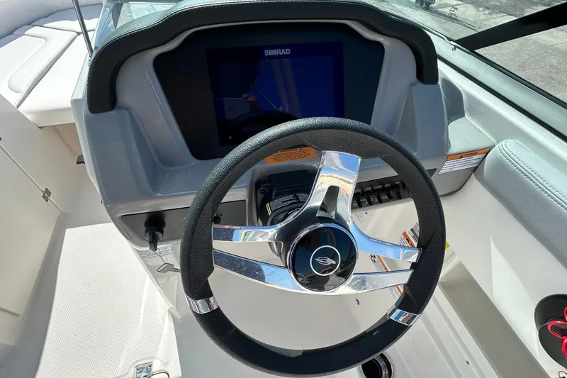 Slide: The Image of Steering wheel and dashboard of 2025 Chaparral 23 SSi OB boat. - 12