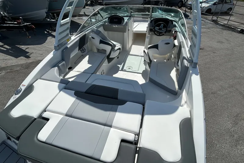Slide: The Image of 2025 Chaparral 23 SSi OB boat interior with sleek seating and modern design. - 9