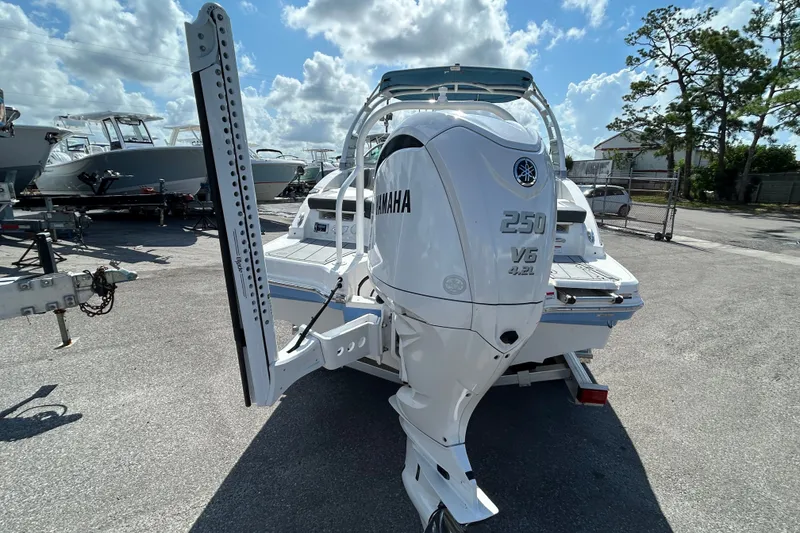 Slide: The Image of 2025 Chaparral 23 SSi OB boat with Yamaha 250 V6 engine in a marina. - 5