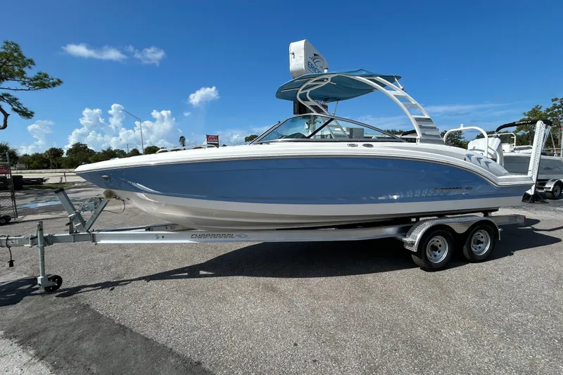 The Image of 2025 Chaparral 23 SSi OB boat on trailer under clear blue sky. - 1