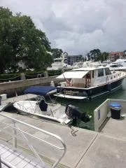 Slide: The Image of 2001 Grand Banks 49 Eastbay SX docked at a marina with nearby boats. - 4