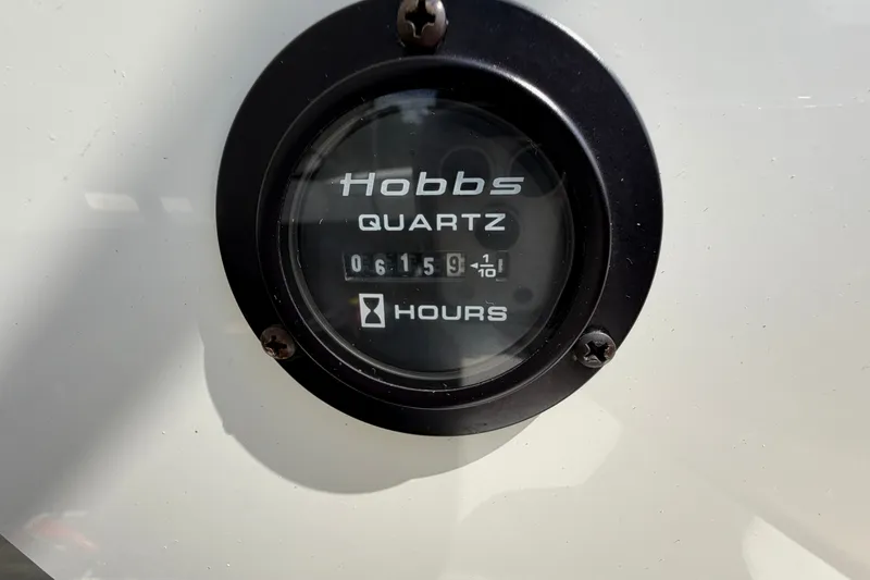 Slide: The Image of Hobbs quartz hour meter displaying 615.9 hours on a 2007 Cobalt 250. - 26