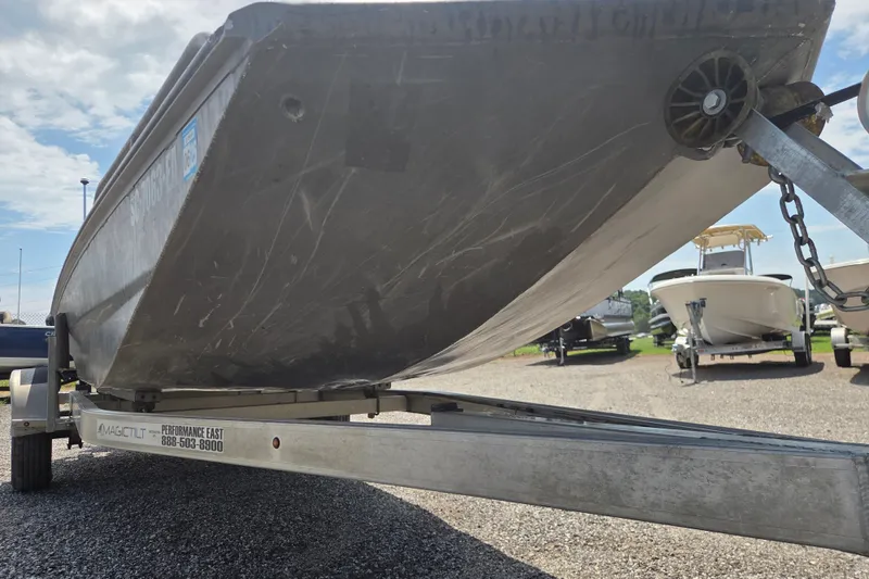 Slide: The Image of 2022 Gator Tail Extreme series boat on trailer, parked outdoors. - 4