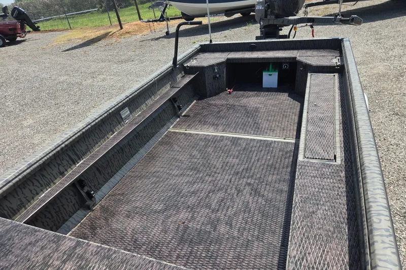 Slide: The Image of 2022 Gator Tail Extreme series boat interior with textured flooring and storage compartments. - 16
