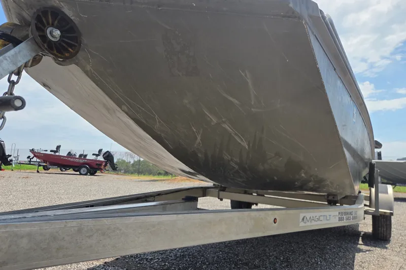 Slide: The Image of 2022 Gator Tail Extreme series boat on trailer, parked outdoors under a clear sky. - 2