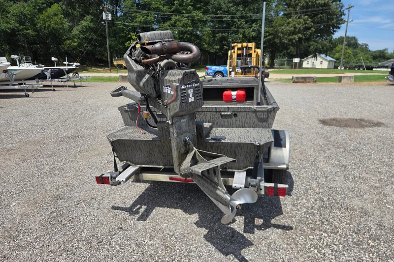 Slide: The Image of 2022 Gator Tail Extreme series boat motor on trailer in outdoor setting. - 7
