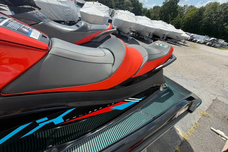 Slide: The Image of 2022 Yamaha WaveRunner VX Cruiser HO with red and black seating, parked outdoors. - 9