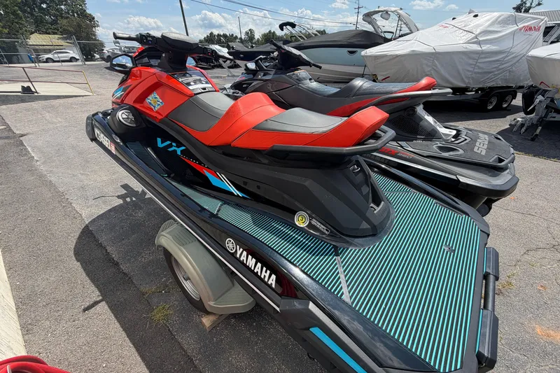 Slide: The Image of 2022 Yamaha WaveRunner VX Cruiser HO on trailer, vibrant red and black design. - 3
