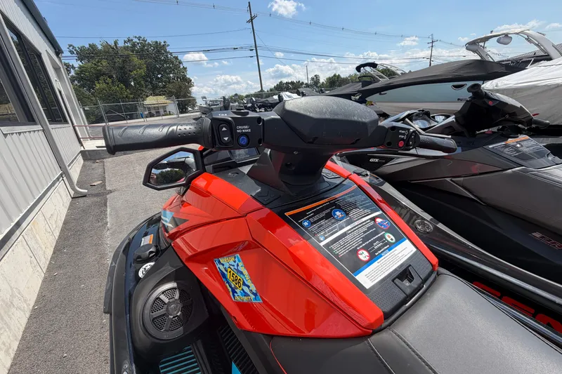Slide: The Image of 2022 Yamaha WaveRunner VX Cruiser HO, red and black, parked outdoors on a sunny day. - 8